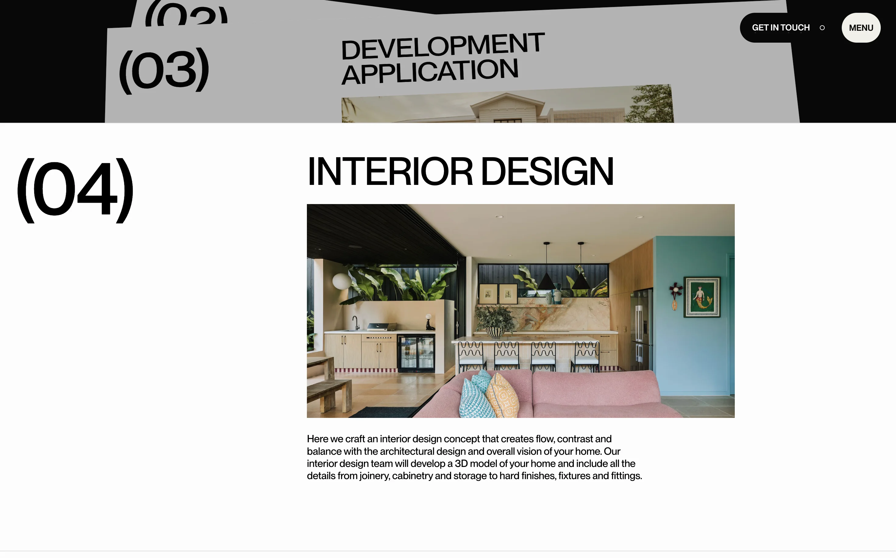 Modern interior design of a living area with a pink couch, patterned cushions, bar stools, and a kitchen with wooden cabinets and decorative plants.